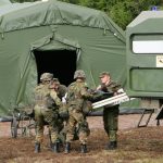 Medical Service: Delivery of a wounded person by ambulance (wheelchair) to an emergency station. Photo: German Armed Forces / Marcus Rott